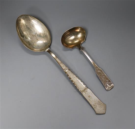 A Danish white metal basting? spoon and a Danish white metal sauce ladle.